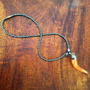 Black Beaded Necklace with Orange Horn Pendant